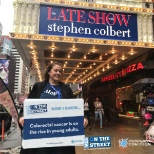 Vanessa holding sign outside The Late Show with Stephen Colbert.