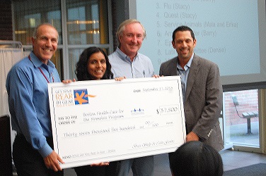 Brian Shelly presents Boston Health Care for the Homeless with grant check