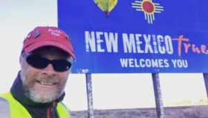 Dave Klein takes a selfie as he enters New Mexico, stopping by the welcome to New Mexico sign