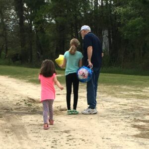 Glenn Honeycutt with his granddaughters a week after surgery
