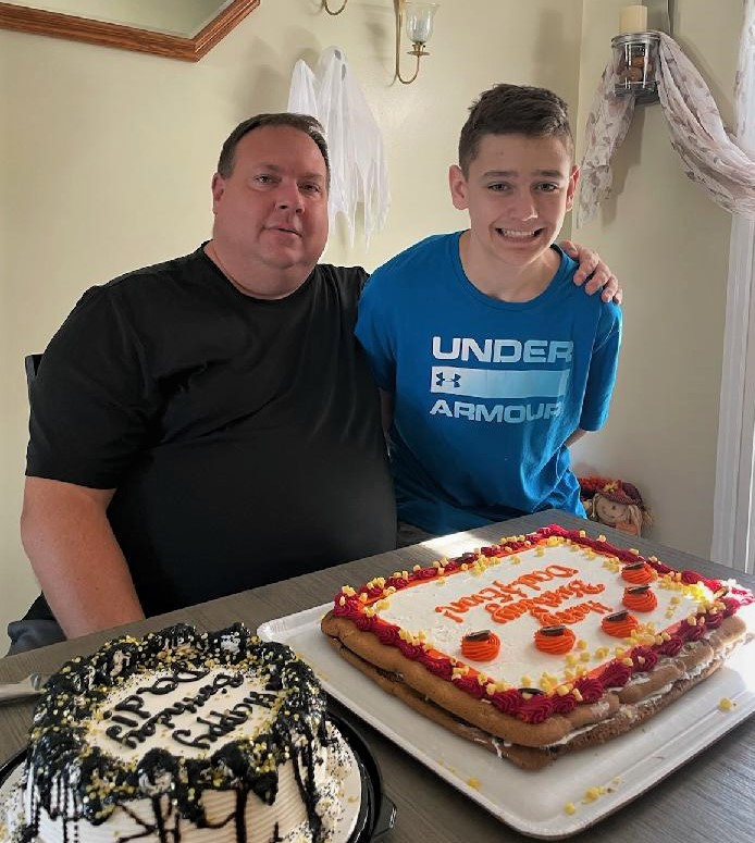Tracy's Husband and youngest son with some cake on her husbands birthday. 
