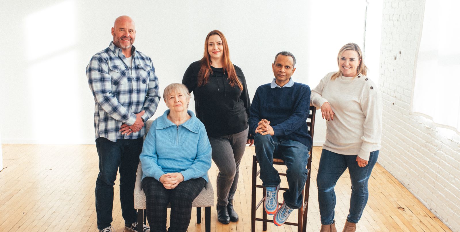 Five colon cancer survivors, two men and three women look at the camera
